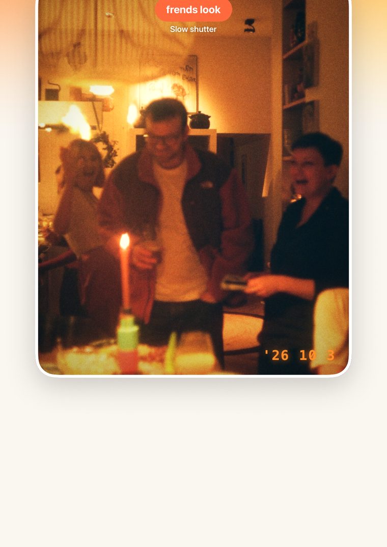 The camera in frends look: friends round a candle at home, with the date stamped in the corner.